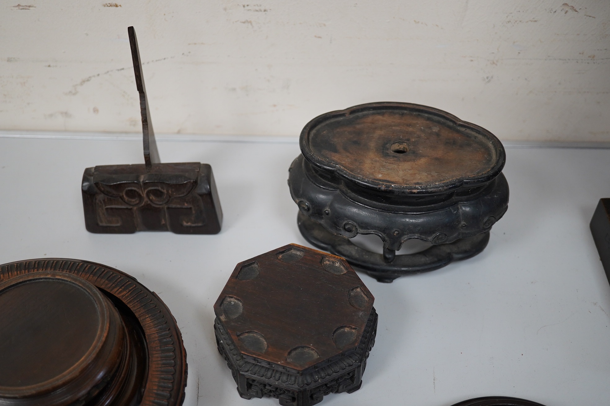 A group of 19th century and later Chinese hardwood stands, largest 18cm in diameter. Condition - mostly fair to good